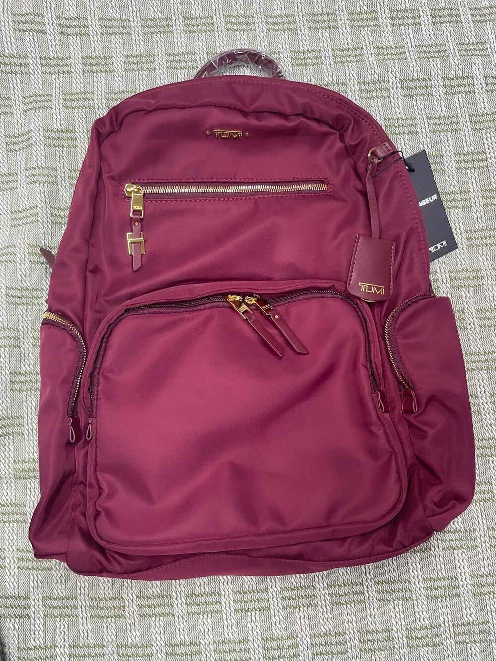 Tumi Burgundy Backpack with Gold Hardware